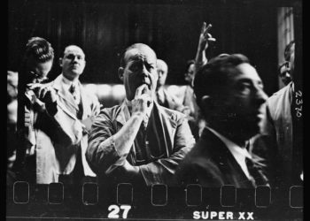 11.-Unidentified-man-standing-among-a-group-of-men-following-the-developments-on-the-trade-board-at-the-Merchandise-Mart.jpg